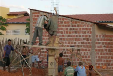 Ps Esteves and crew working on concrete pillars for the new hall at Gadelha