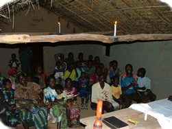 A meeting held by candlelight at Kabombu