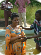 Mama Sophia being baptized by Ps Eddie